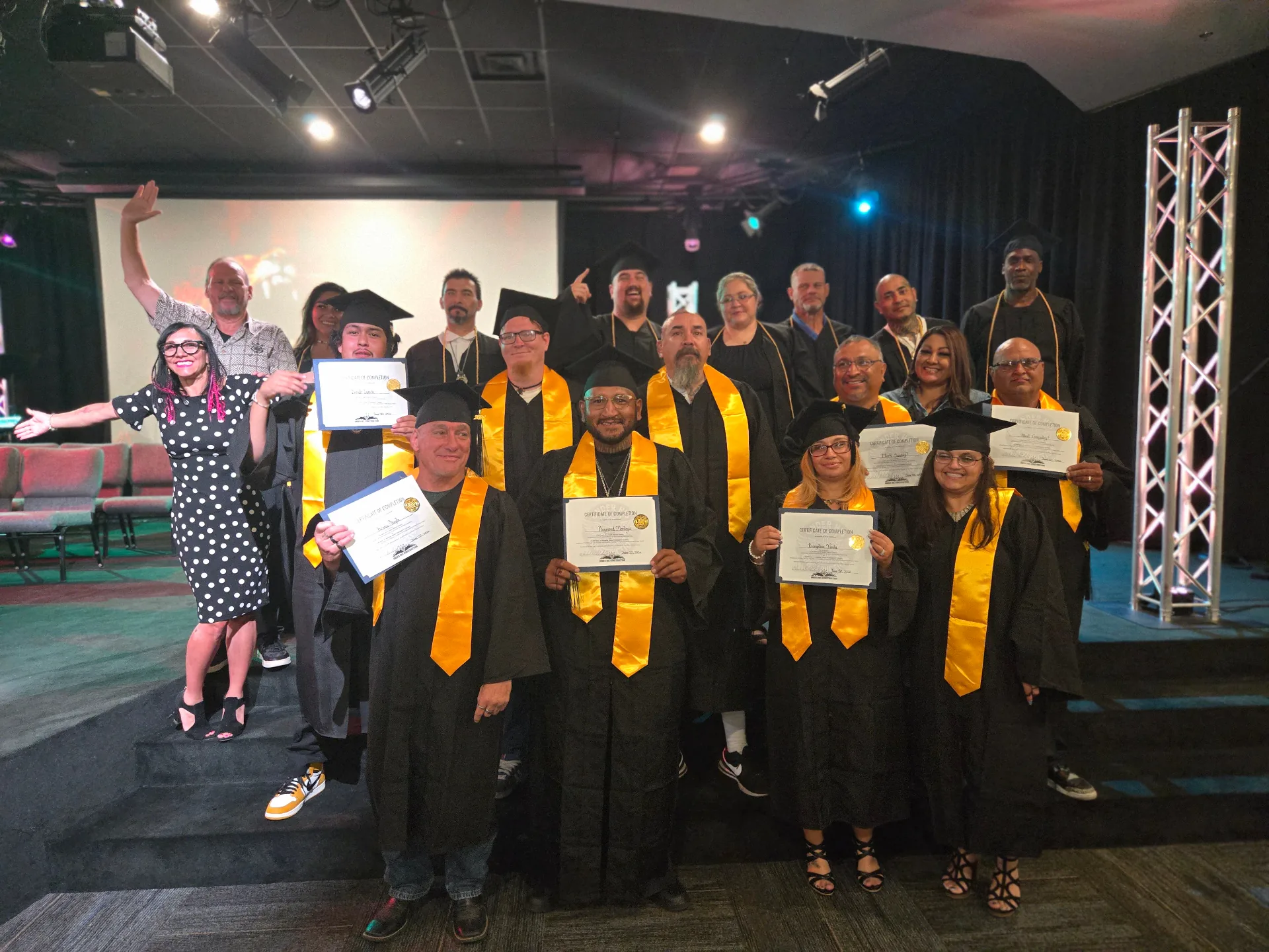 Under HIS Construction residents celebrating program graduation